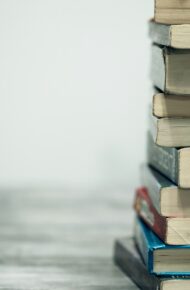 assorted books on wooden table